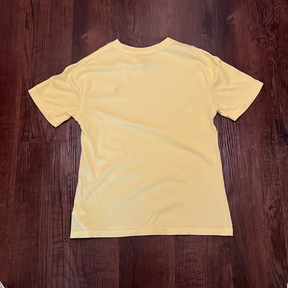 Yellow polo with light blue logo. - Picture 2 of 2
